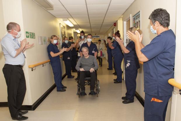 Brett France leaves hospital as medical teams clap his recovery