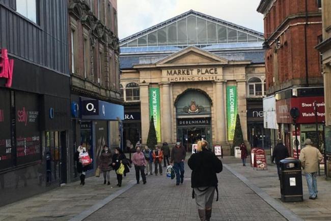 Outside Market Place Shopping Centre in Bolton town centre